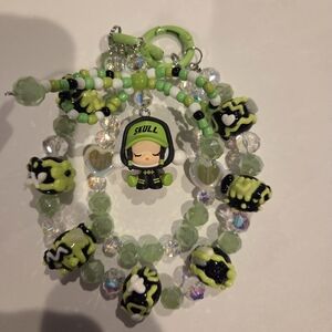 Green and Black Beaded Bracelet with Skull Charm